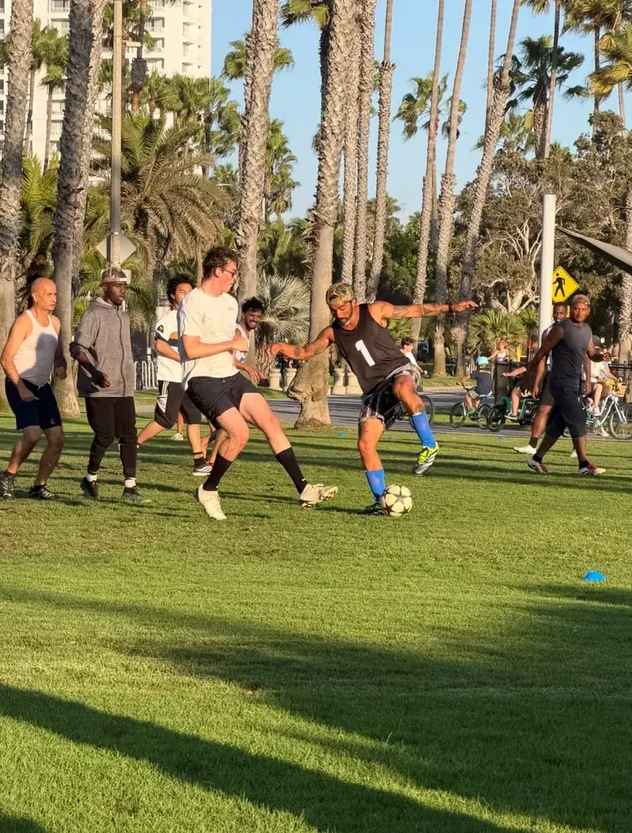 Pickup soccer game on the grass in a Santa Monica park